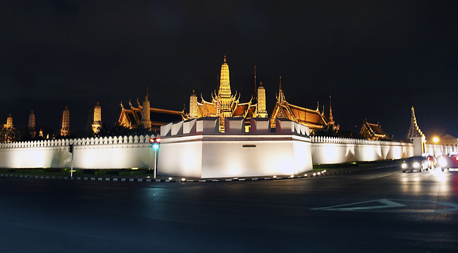 The Grand Palace's lit walls and spires at night, Bangkok